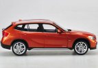 Orange / Black 1:18 Scale Kyosho Diecast BMW X1 Model
