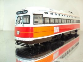 1:43 scale white-orange CORGI brand single-deck trolley bus
